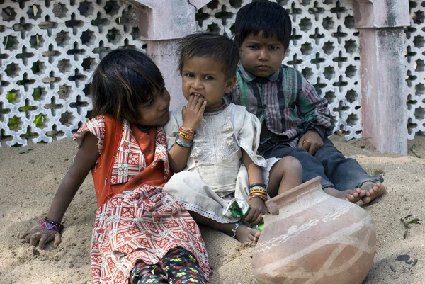 depositphotos_35466771-stock-photo-three-poor-slum-children-playing